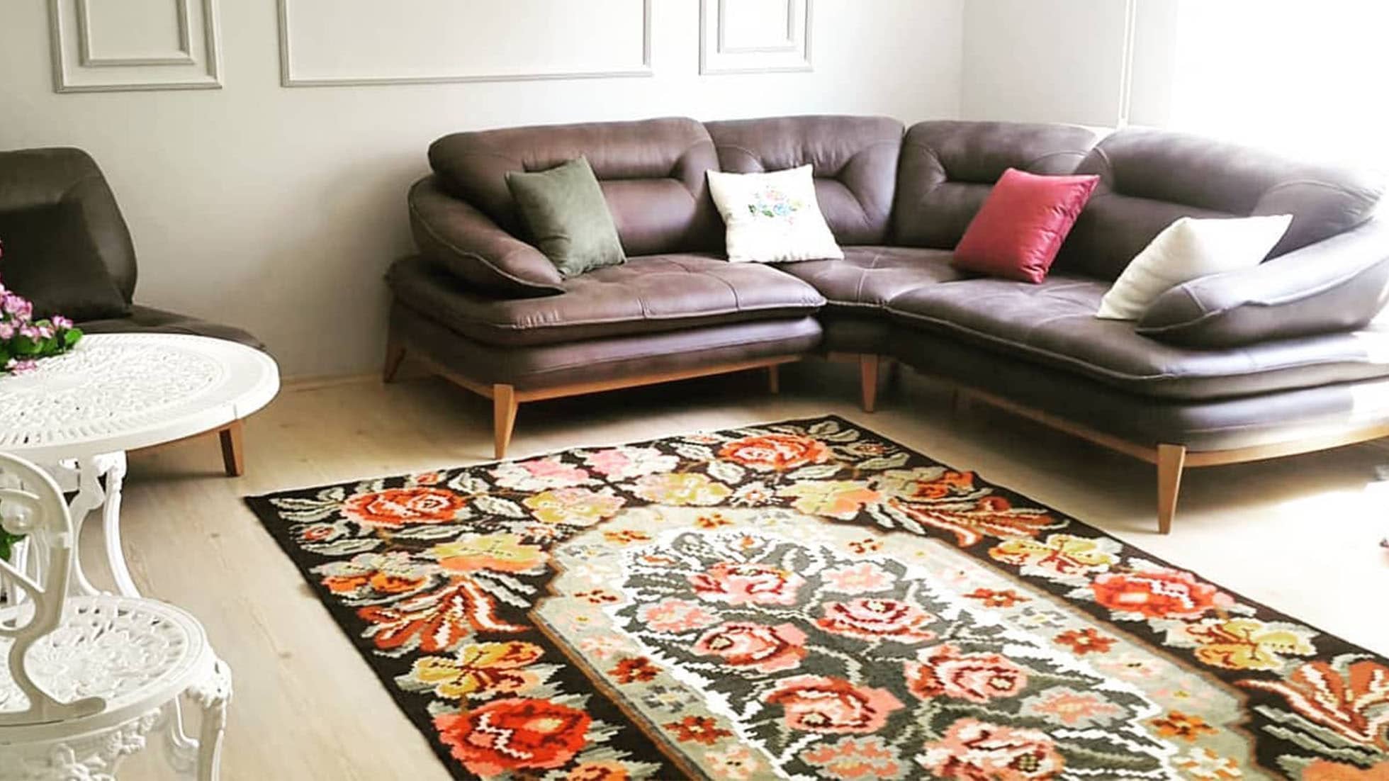 A global-inspired home interior featuring a chic Bessarabian floral oriental rug from a Kilim Couture New York client