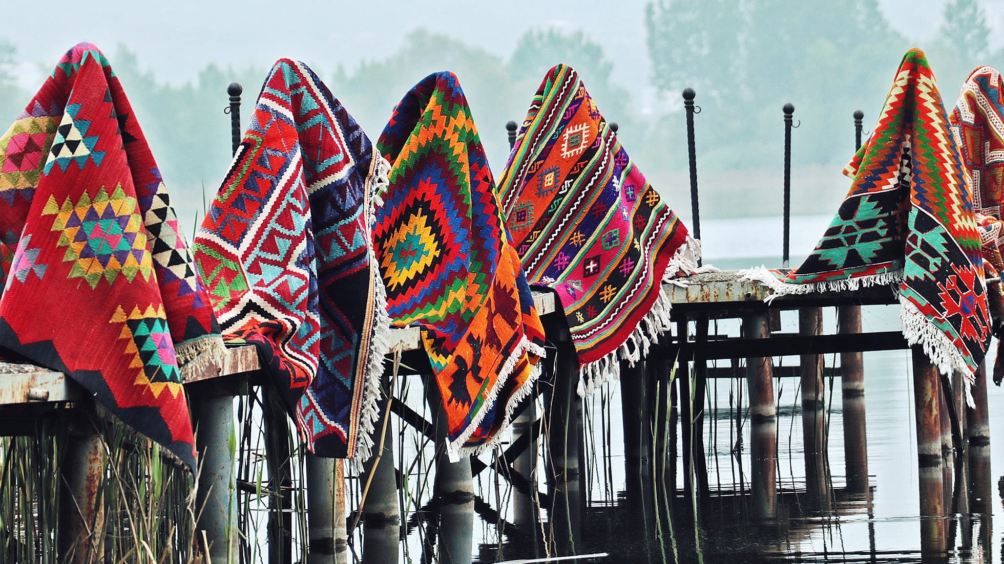 vintage tribal Turkish kilim rugs hanging at the pier