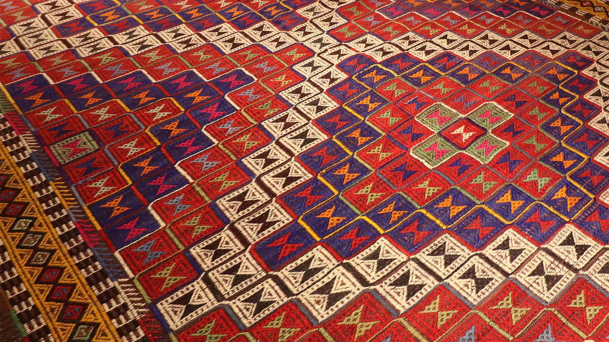 Vintage Cecim Kilim with earthy and muted red, brown tones