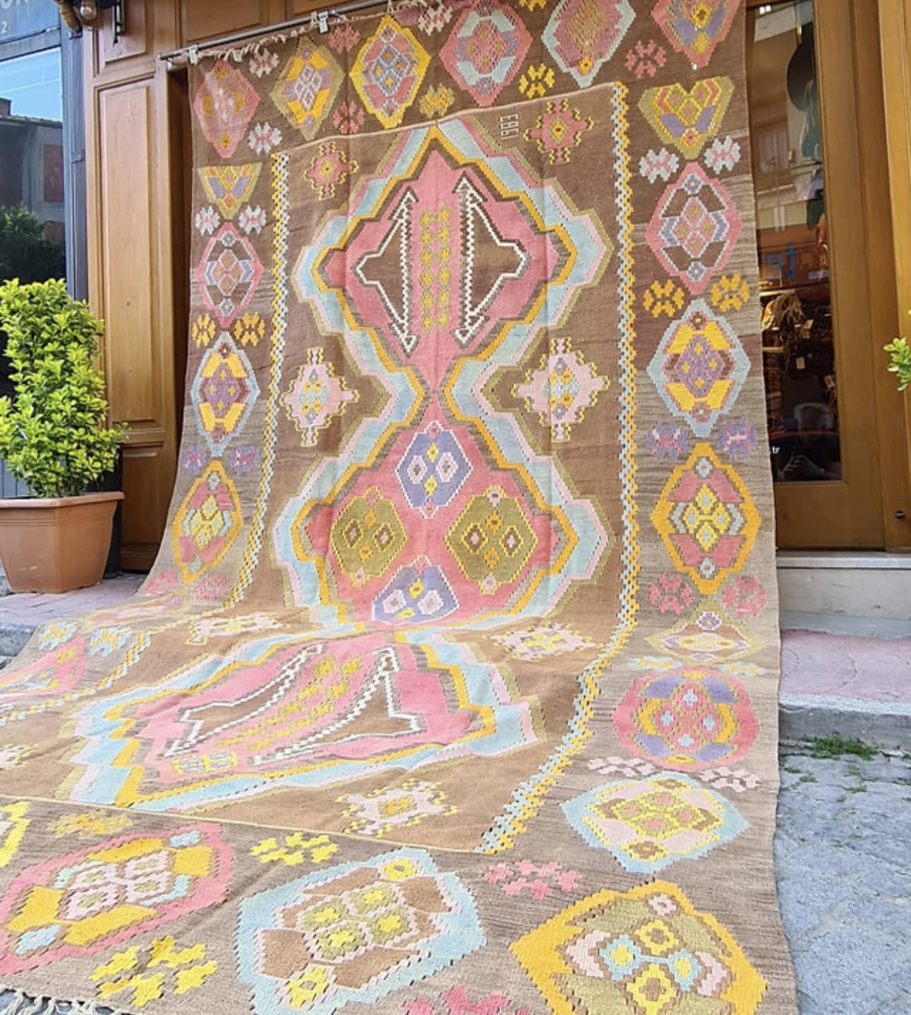 1983 signed caucasian gallery size medallion kilim in pastel hues