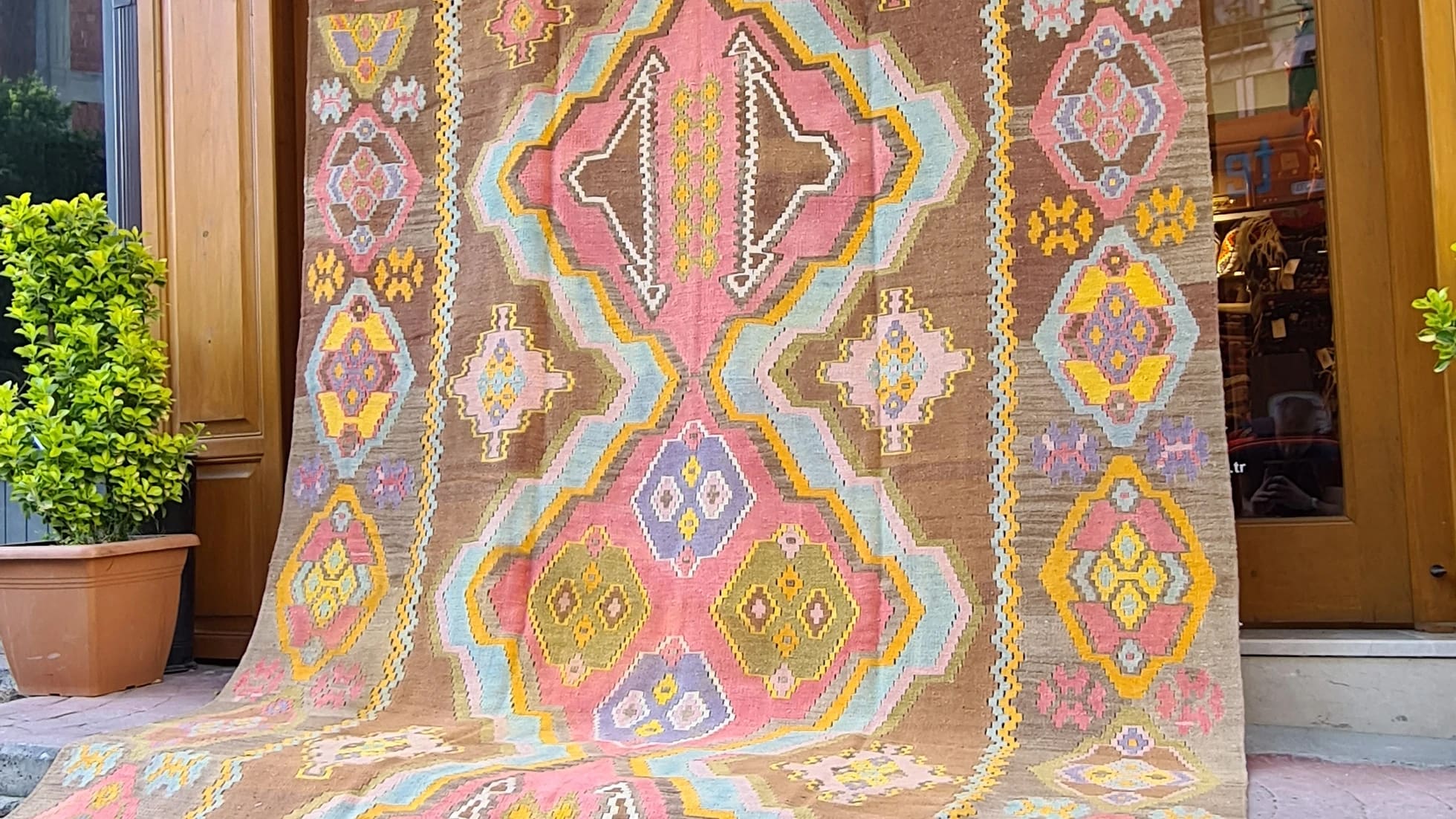 1983 signed caucasian gallery size medallion kilim in pastel hues