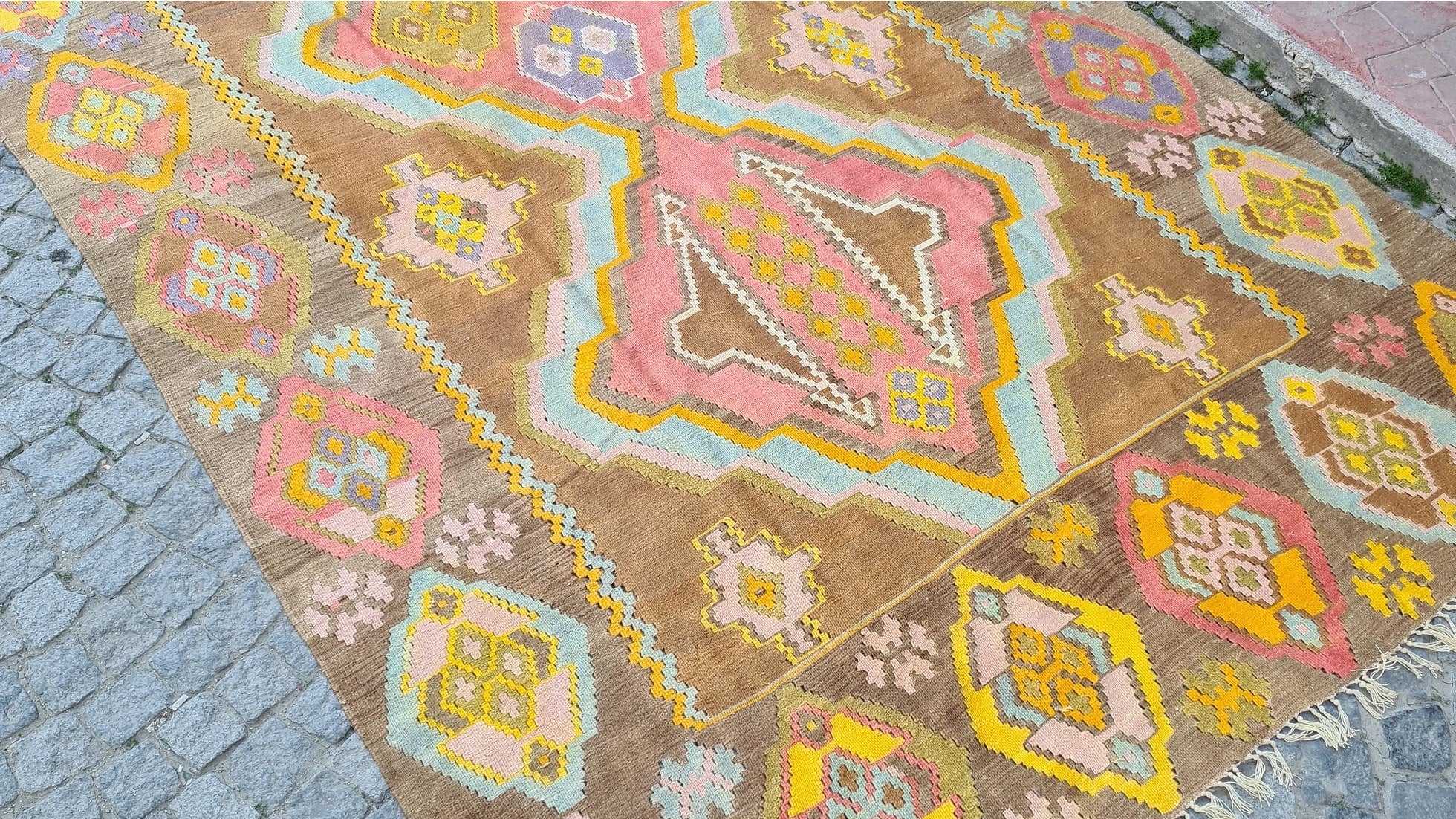 1983 signed caucasian gallery size medallion kilim in pastel hues