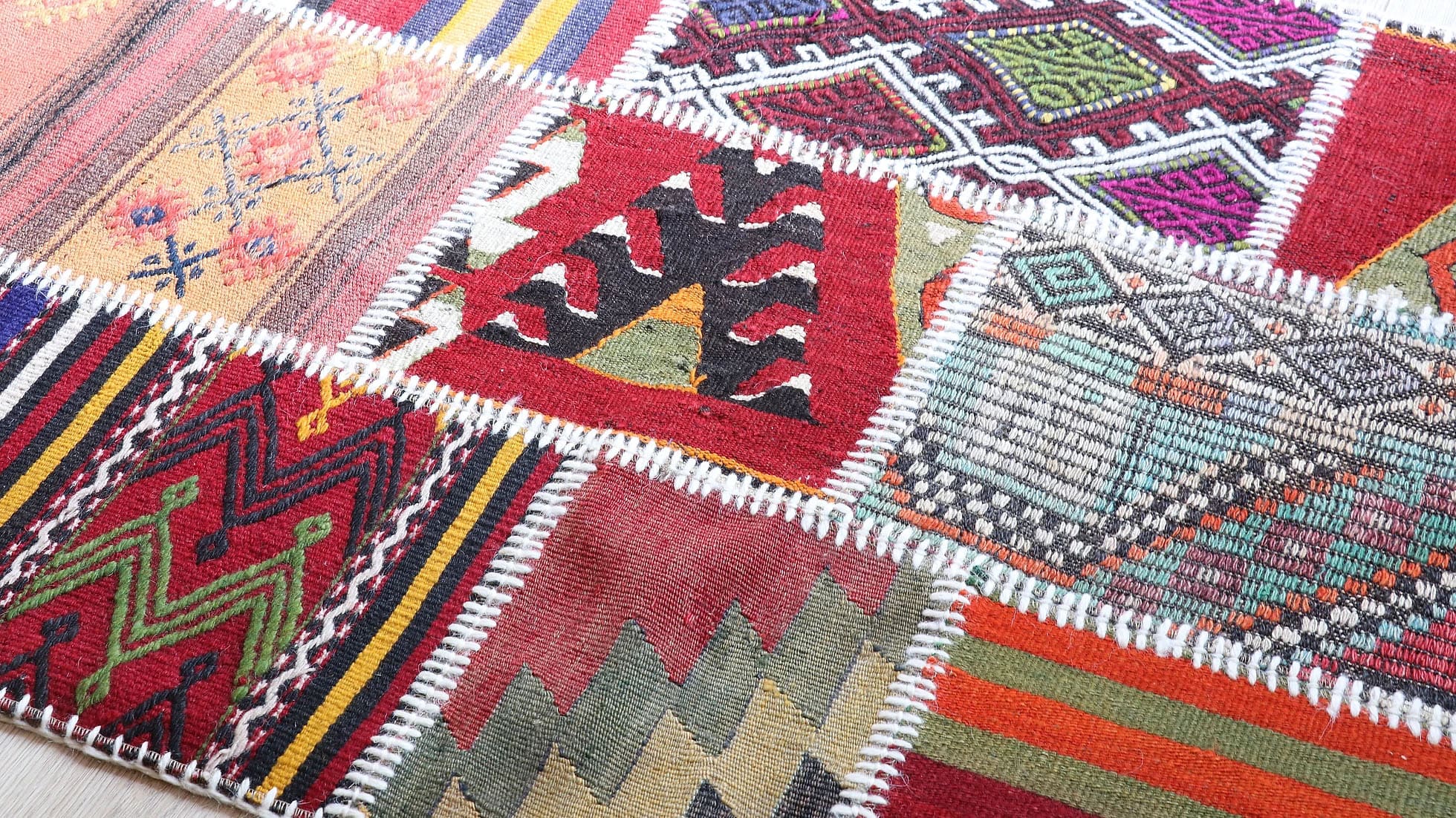 details of a handwoven traditional Turkish kilim rug in colorful pattern