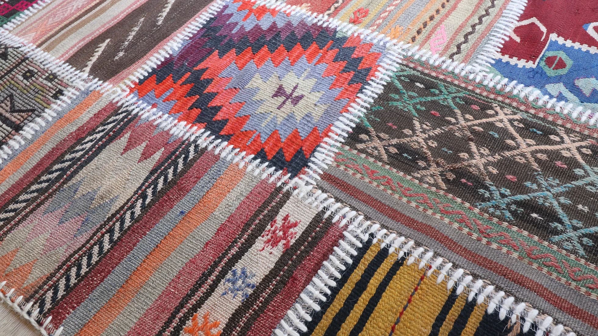 details of vintage handmade Turkish quilt rug