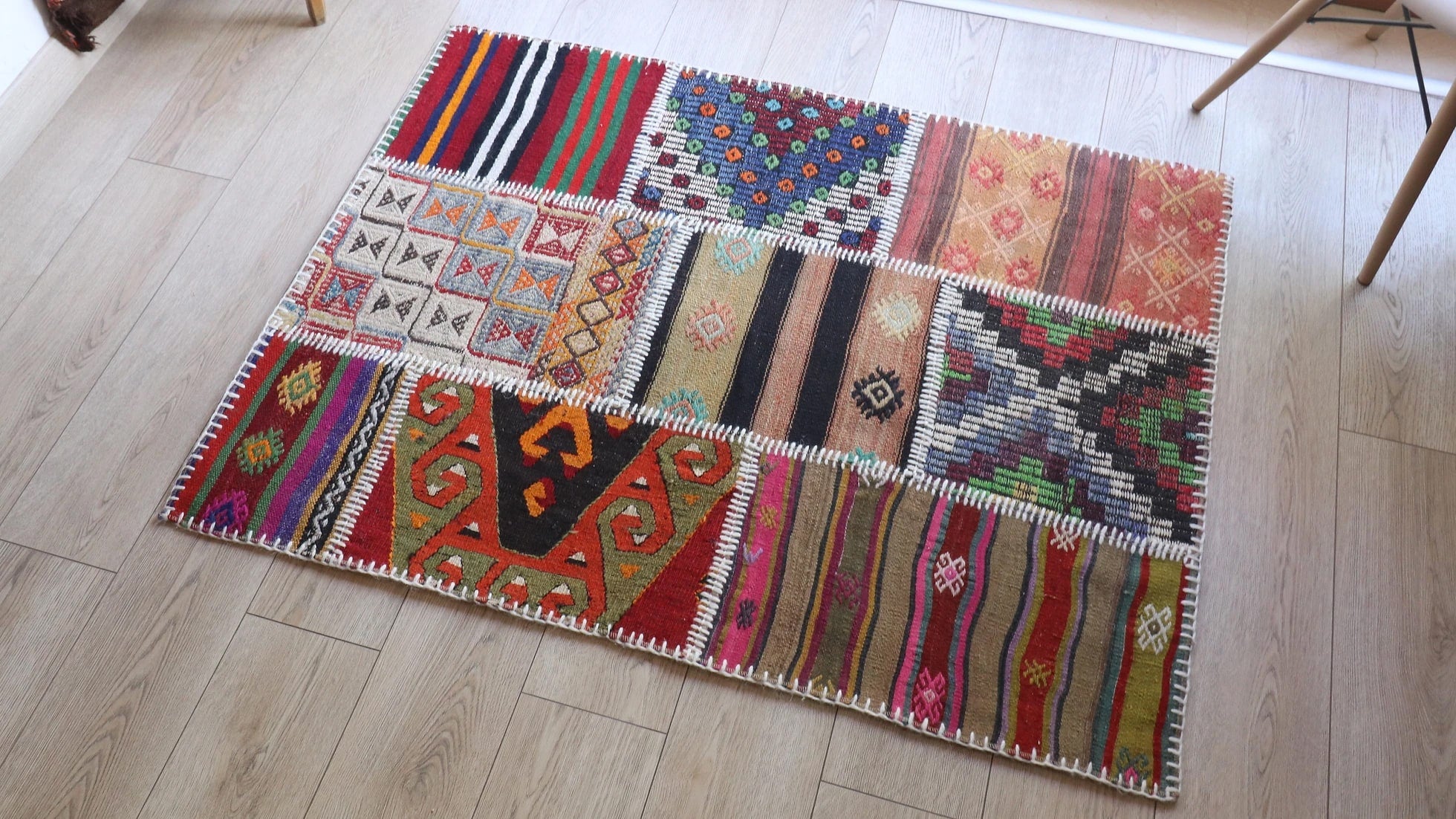 handwoven patchwork rug constructed with antique rug fragments