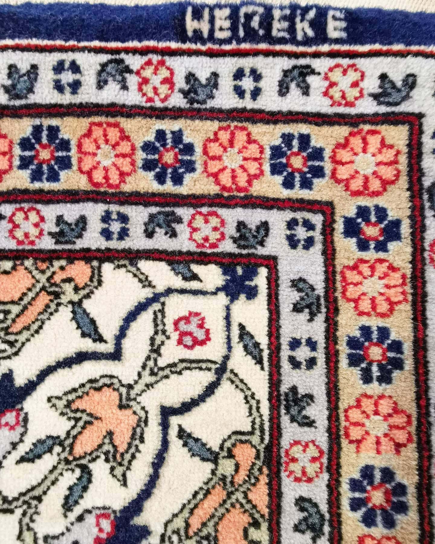 luxury fine antique Turkish Hereke silk carpet in pastel, earthy, and neutral floral motifs and patterns