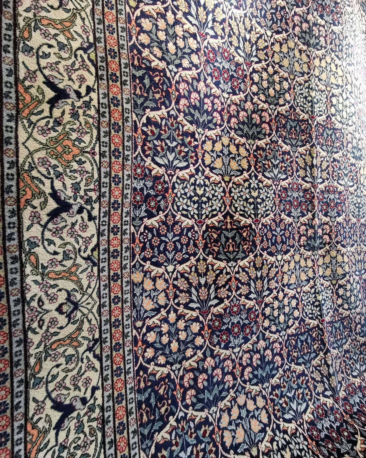 luxury fine antique Turkish Hereke silk rug in pastel, earthy, and neutral floral motifs and patterns