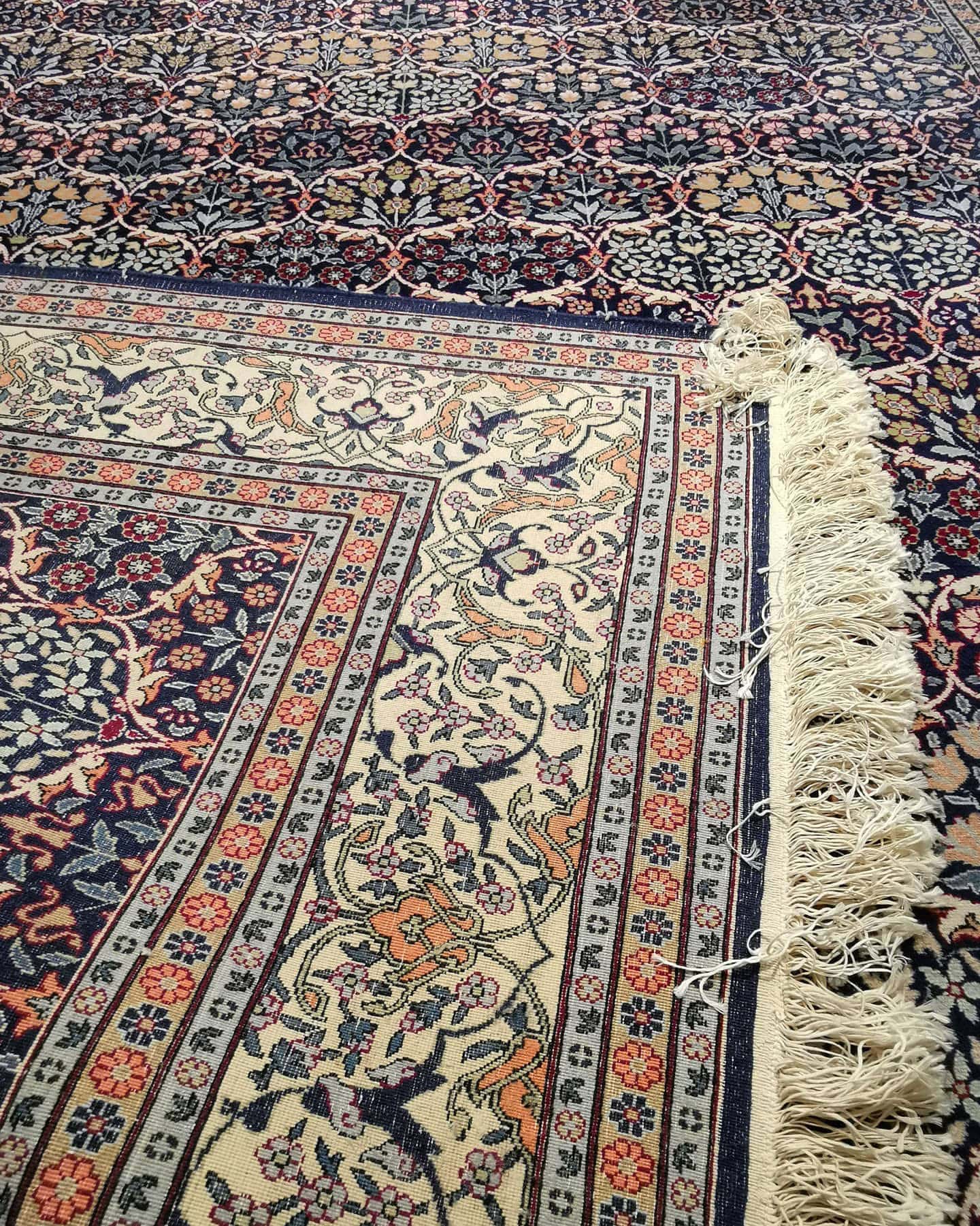 luxury fine antique Turkish Hereke silk carpet in pastel, earthy, and neutral floral motifs and patterns