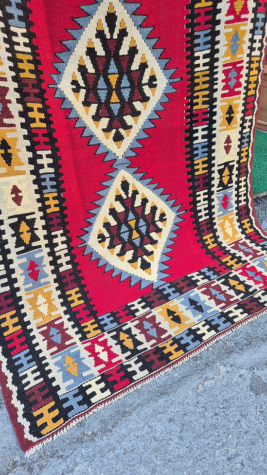 Vintage-style Usak kilim rug with bold crimson canvas and subtle denim and taupe accents