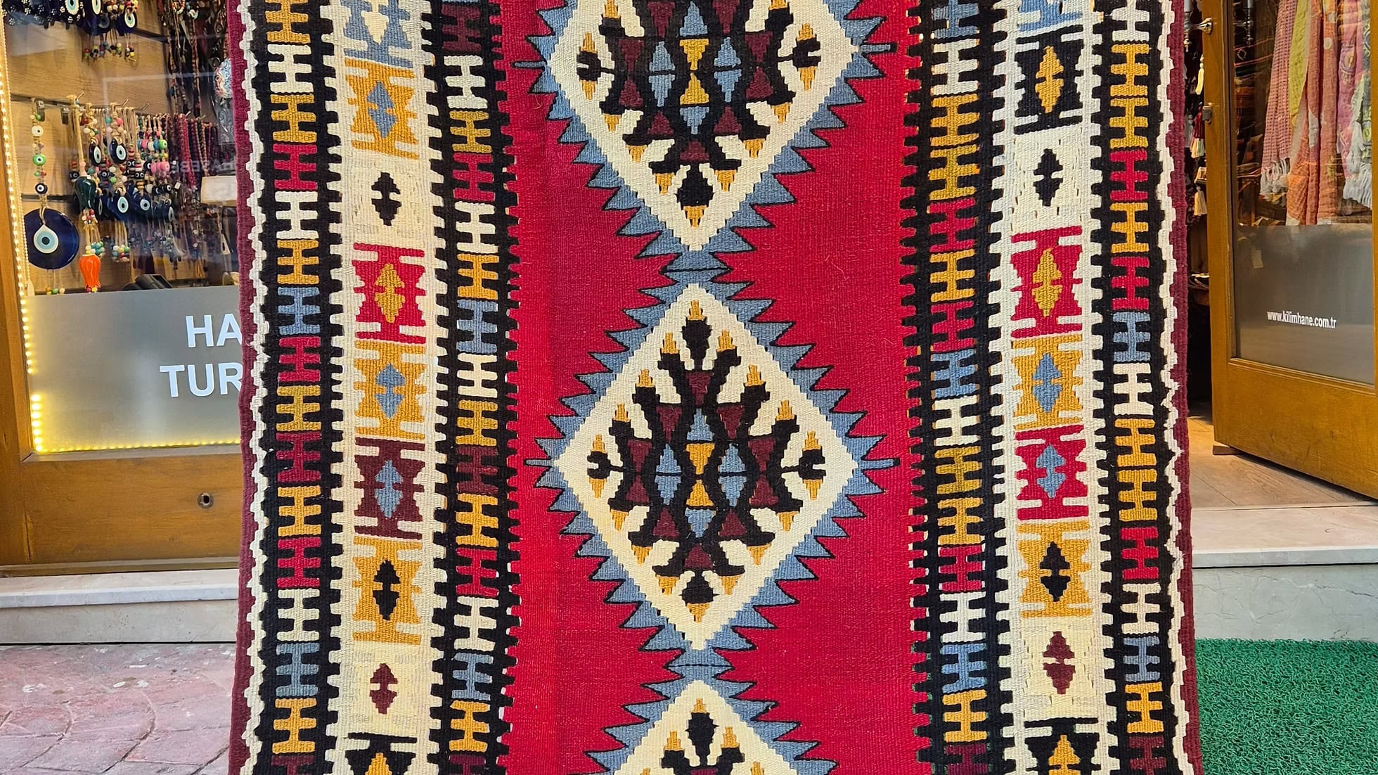 Kilim Couture New York Turkish Oushak accent rug with muted mustard and ivory geometric patterns
