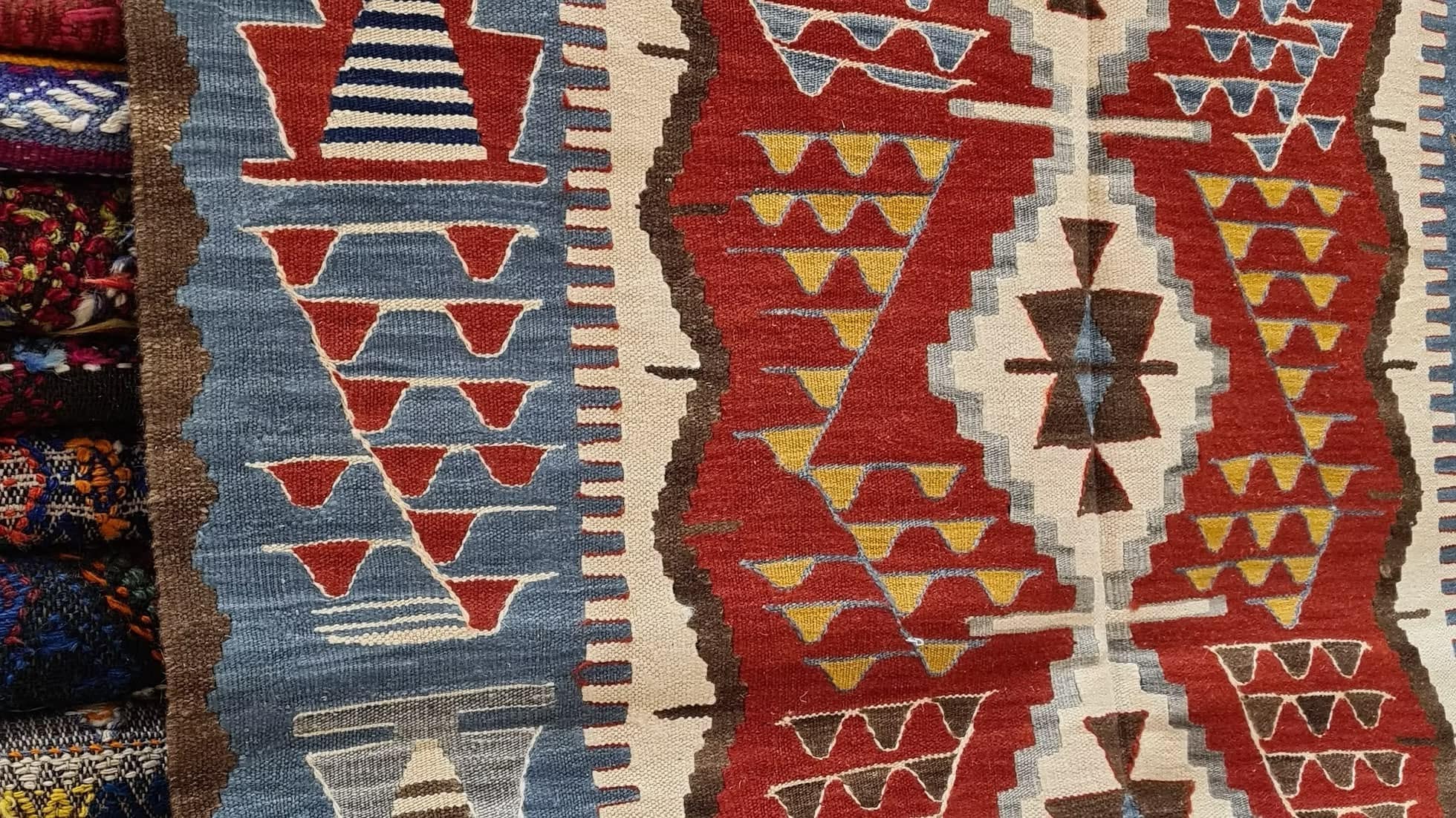 Handwoven Turkish Oushak medium area rug with tribal motifs