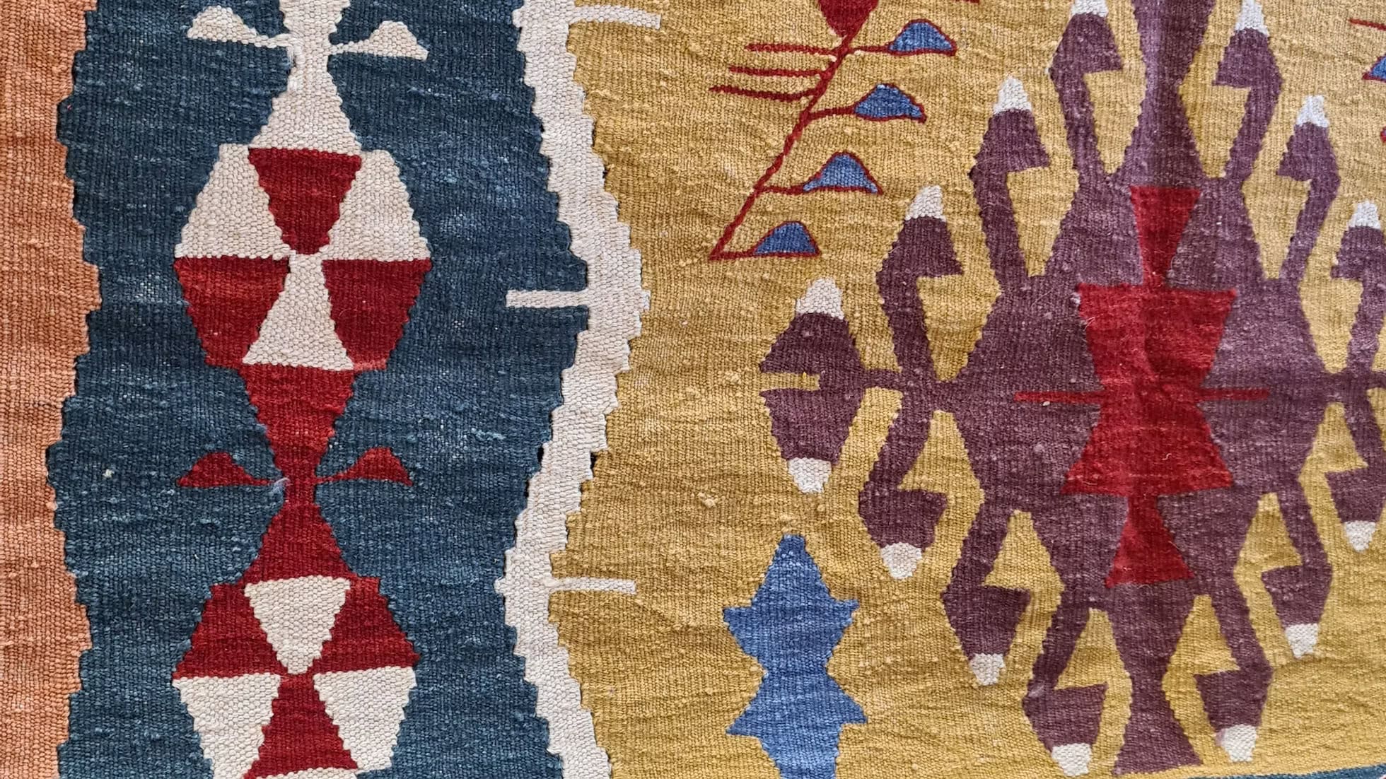 Luxury 4x6 Turkish handwoven kilim rug with geometric design and warm vintage-inspired colors for eclectic or mid-century interiors.