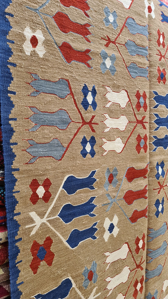 Artistic close-up of the woven tulip pattern on a Kilim Couture NYC rug, blending timeless design with a modern aesthetic, ideal for Southern homes, NYC luxury apartments, and stylish lofts.