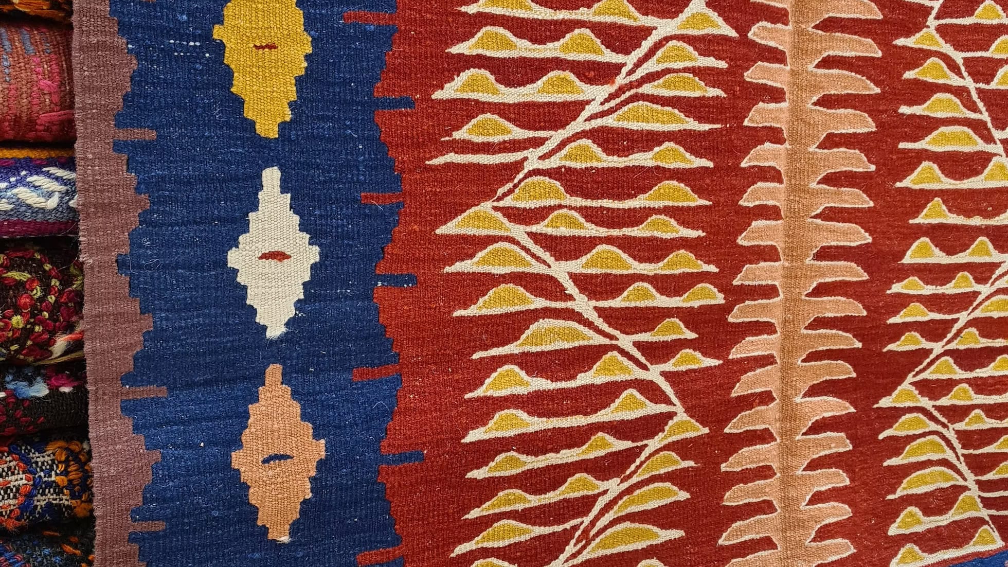 Modern Oushak kilim with geometric saffron motifs and navy border, Turkish artisan rug for interior designers