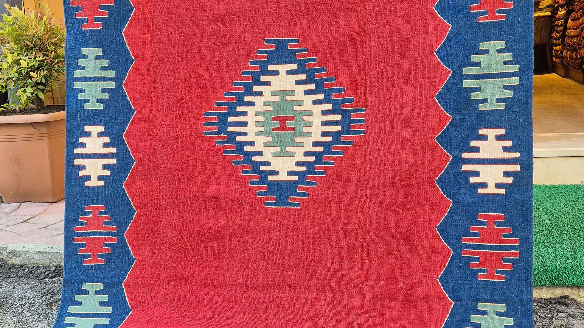 Contemporary Turkish handwoven Oushak rug by Kilim Couture New York in burnished brick and inkstone blue with minimalist geometric design