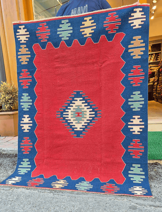 Vintage-inspired Turkish handwoven rug by Kilim Couture New York with contemporary minimalist design and rich cultural symbolism