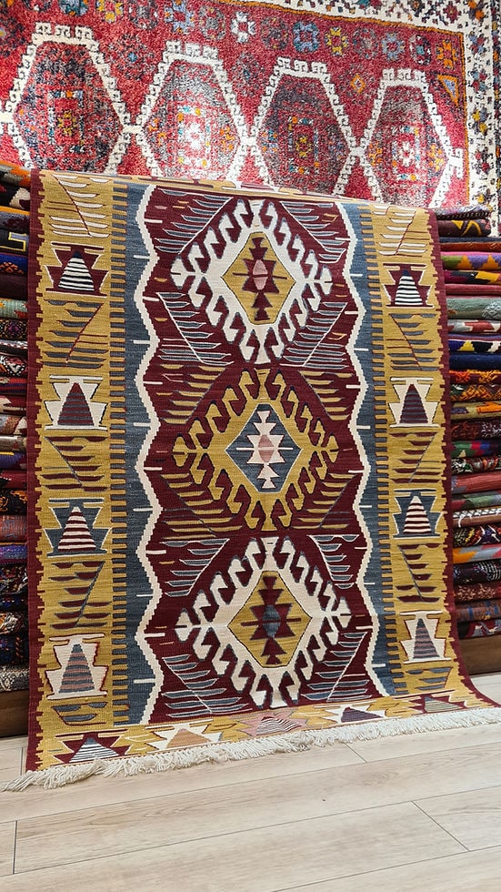 Luxurious handwoven Ushak rug with a rich vintage red wine backdrop and muted mustard accents.