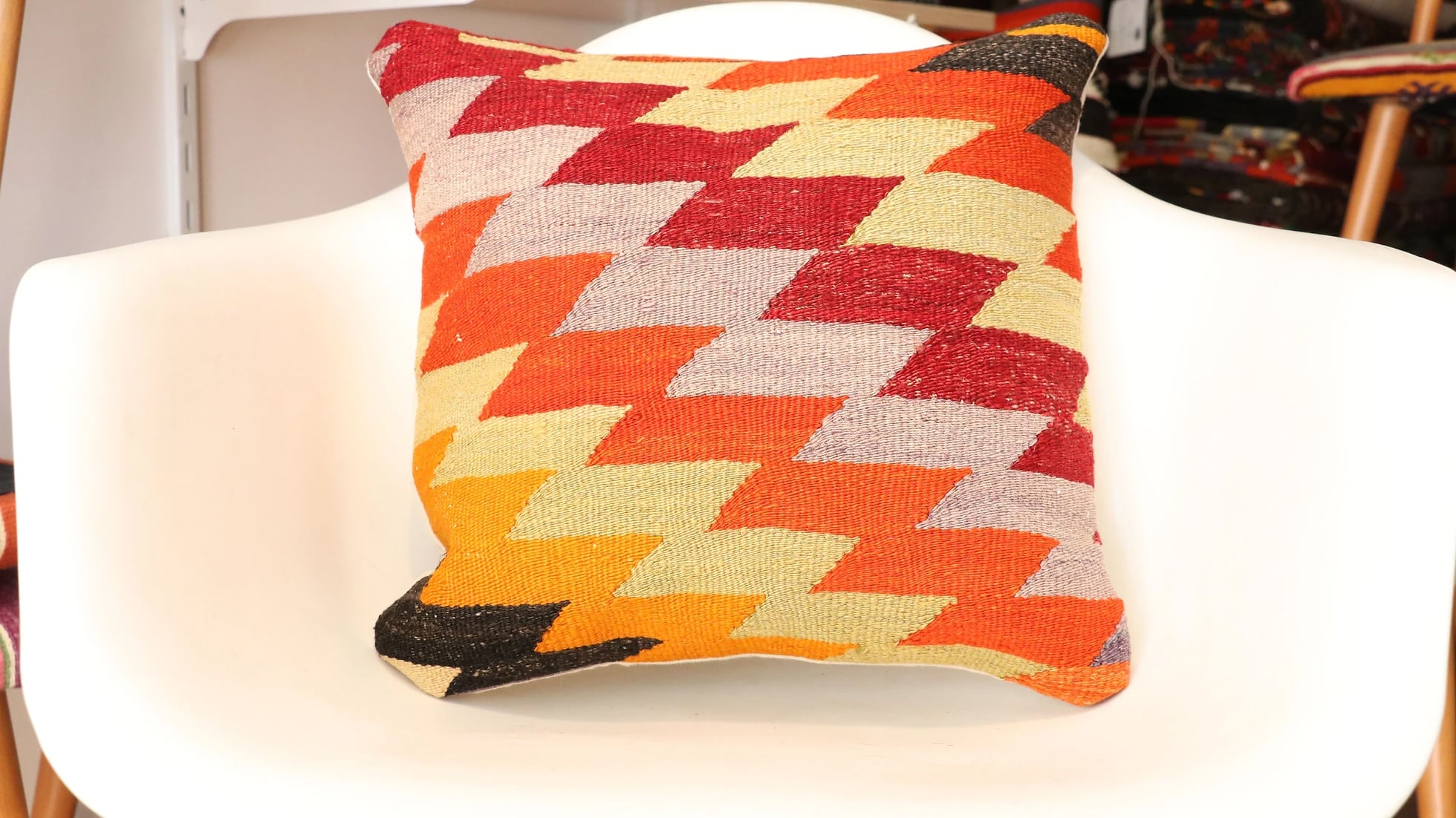 vintage mid-century kilim covered throw pillow with zigzag patterns for cozy homes