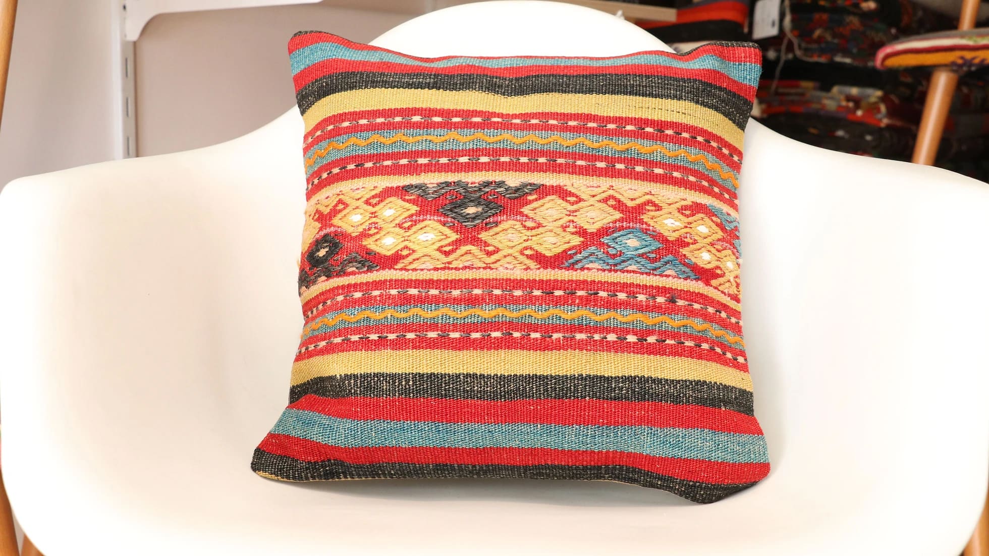 vintage Turkish kilim upholstered throw pillow cover in geometric patterns and stripes by Kilim Couture New York