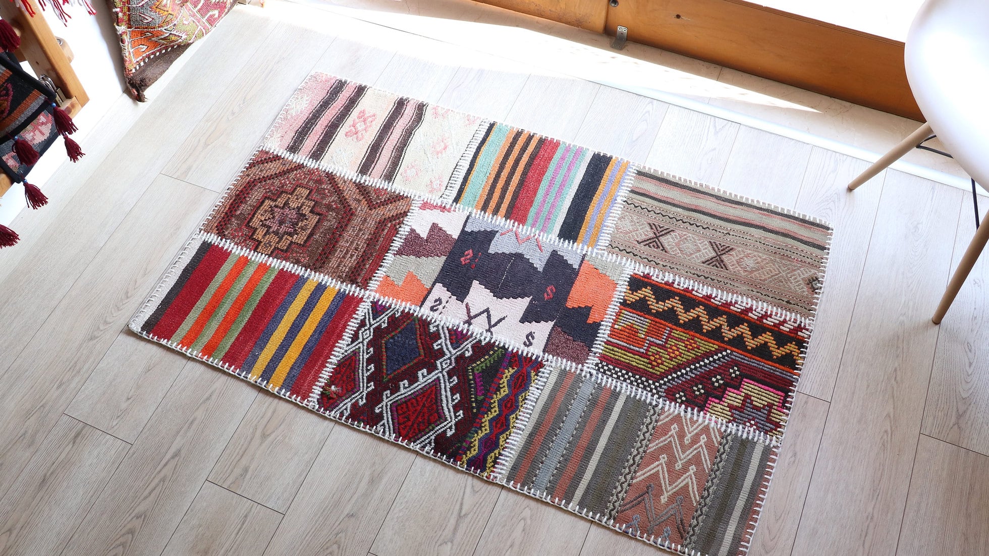 Patchwork antique carpet in vibrant colors and patterns