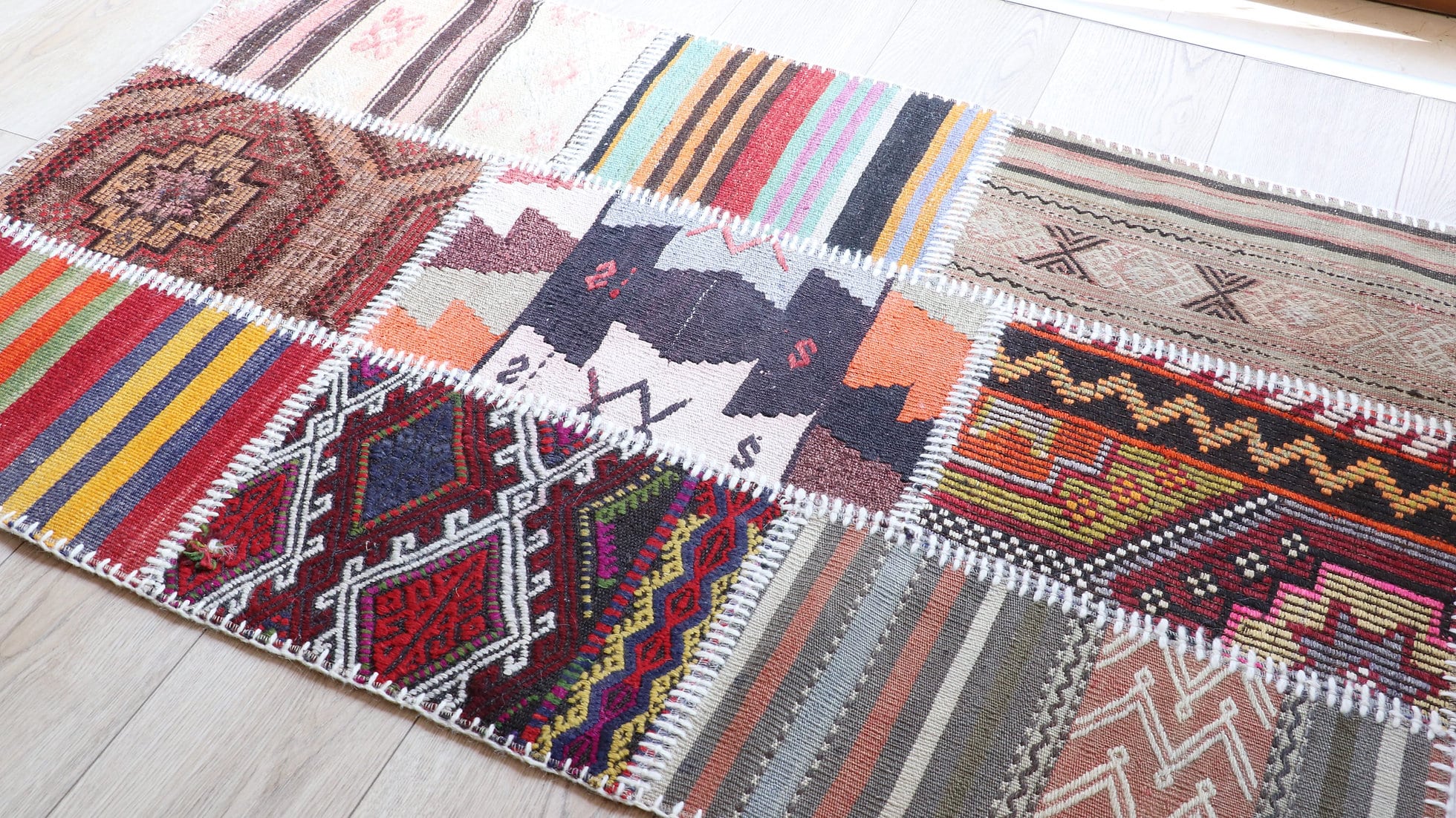 Patchwork antique carpet in vibrant colors and patterns