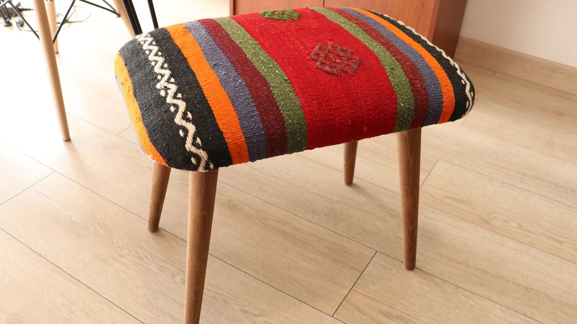 vintage handmade kilim ottoman bench in red, blue, green, orange and maroon stripes from turkey