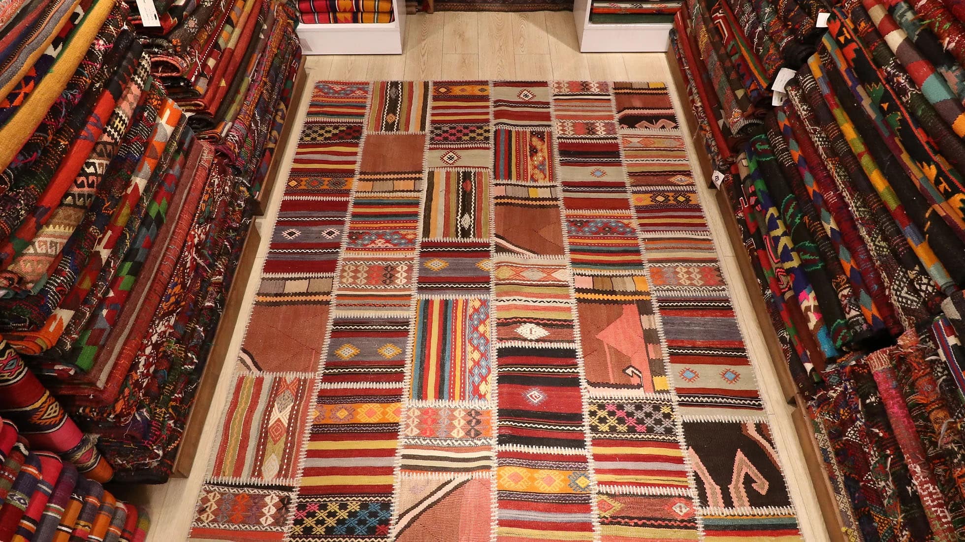 meticulously handwoven semi-antique patchwork rug made of different antique Turkish carpet fragments
