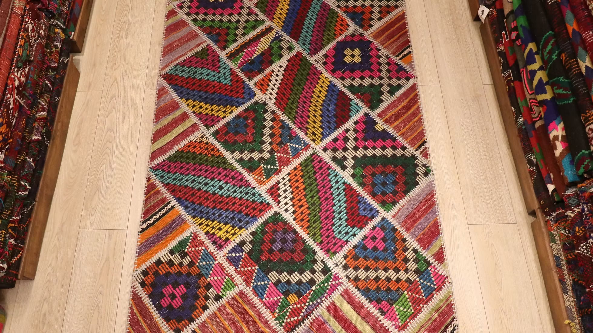 Colorful quilt rug with geometric pattern