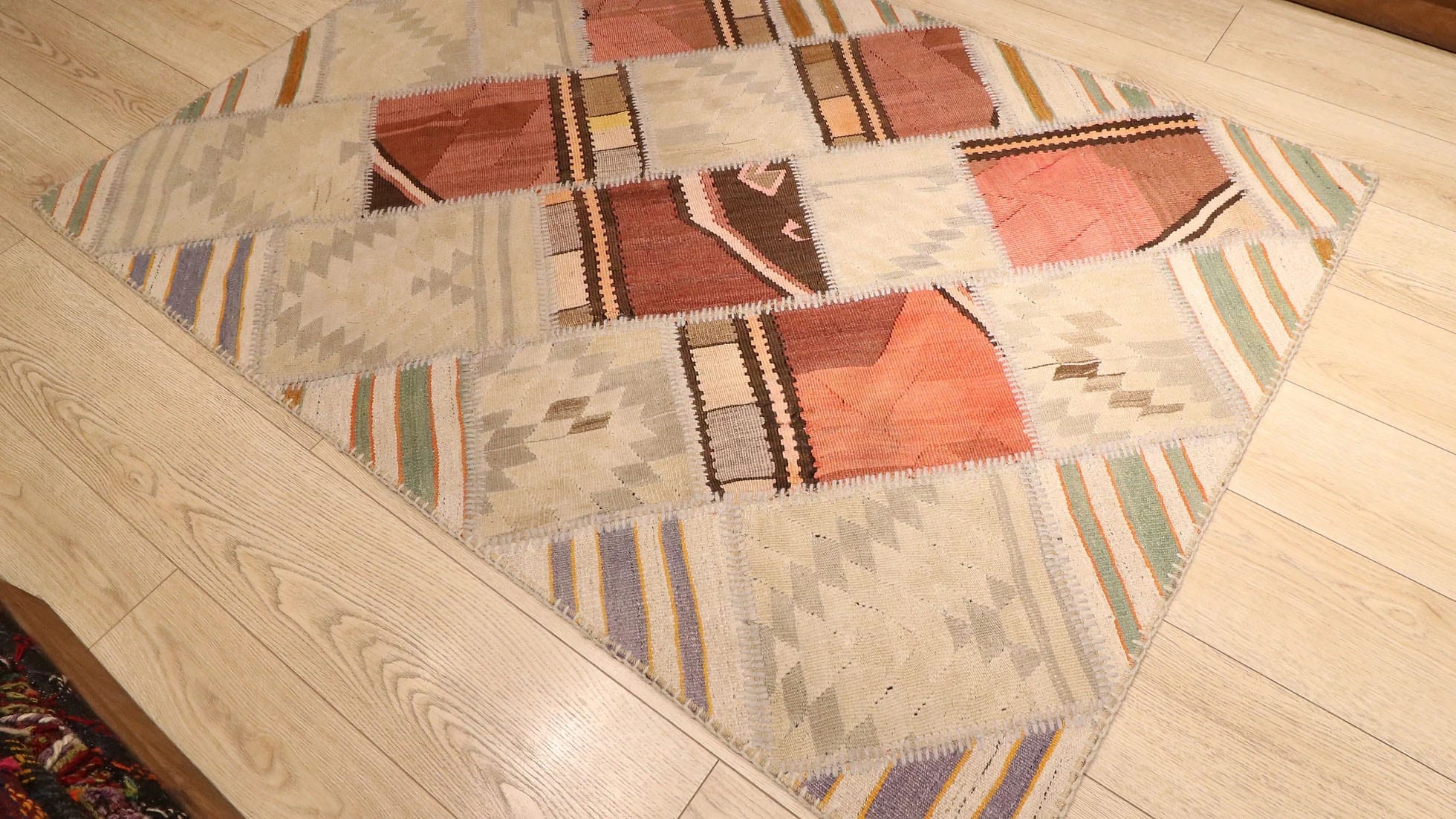 neutral patchwork flat-weave rug in rustic earth tones by Kilim Couture in Manhattan