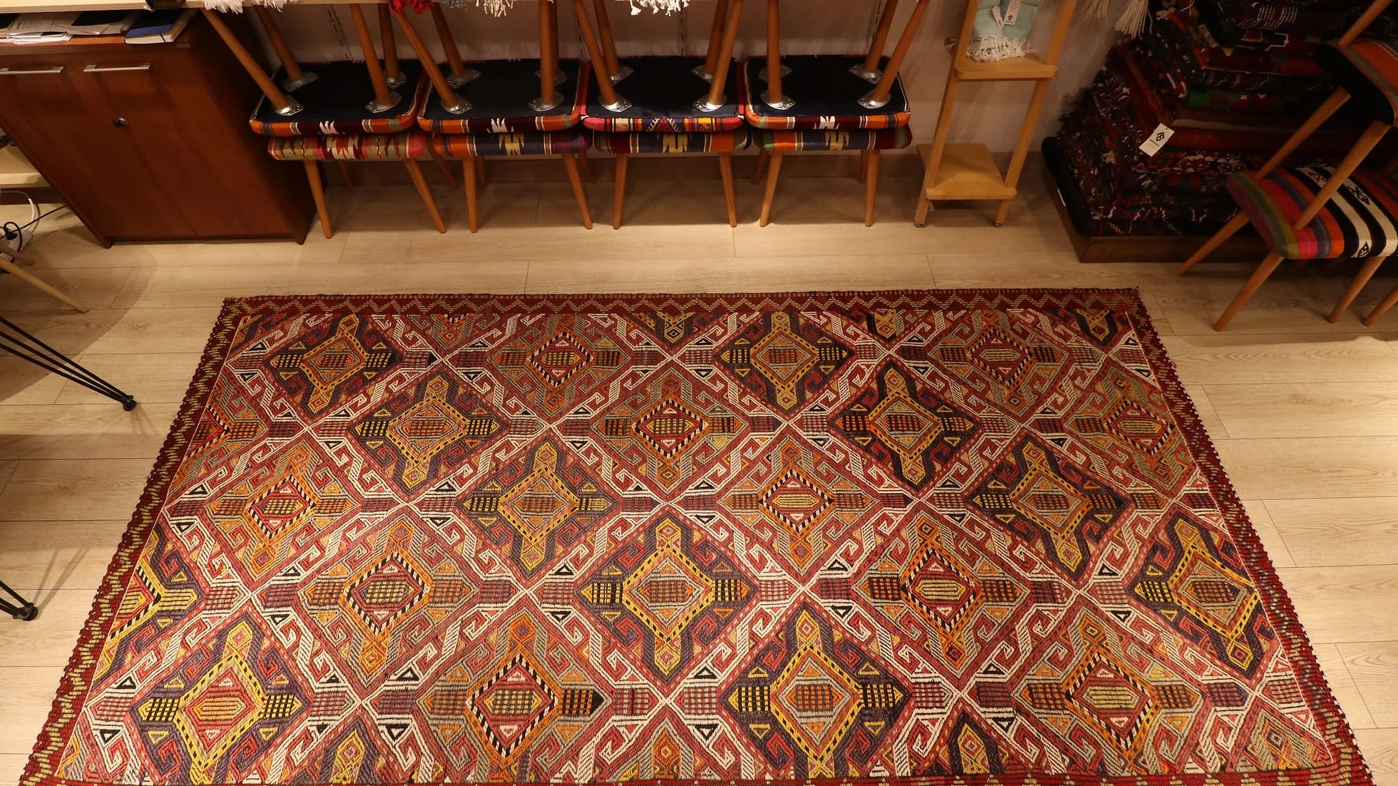 a very captivating Cicim rug from Turkey in natural earthy color palette with many all over traditional geometric patterns and motifs