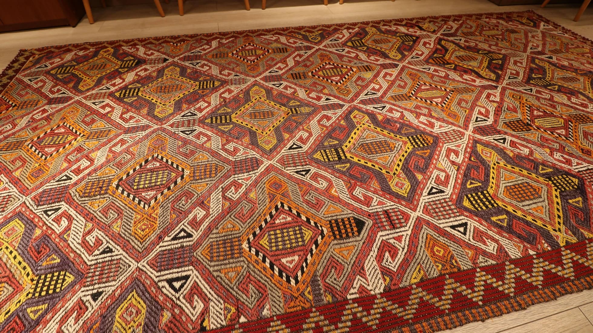 a very captivating Cicim rug from Turkey in natural earthy color palette with many all over traditional geometric patterns and motifs