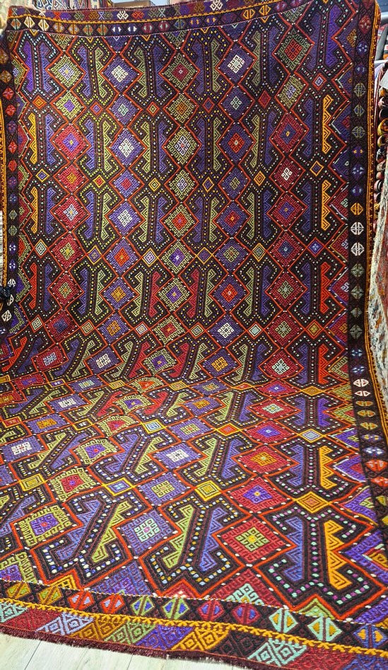 Vintage Turkish kilim rug with intricate weaving and vibrant hues, handpicked by Kilim Couture New York to elevate your farmhouse, cabin, or lodge decor