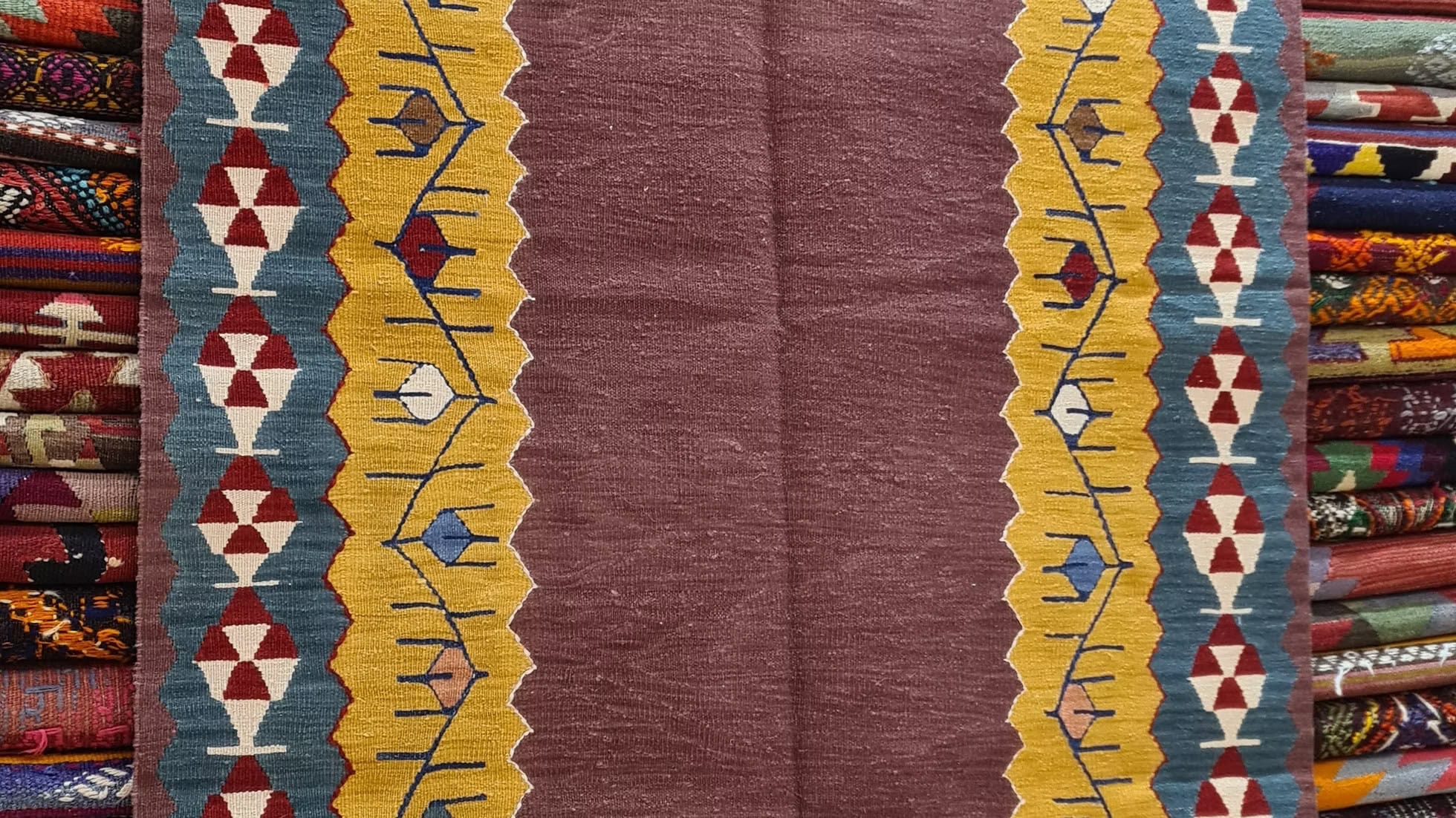 Turkish handwoven Oushak rug in Dusty Plum, Soft Dijon, and Denim Blue