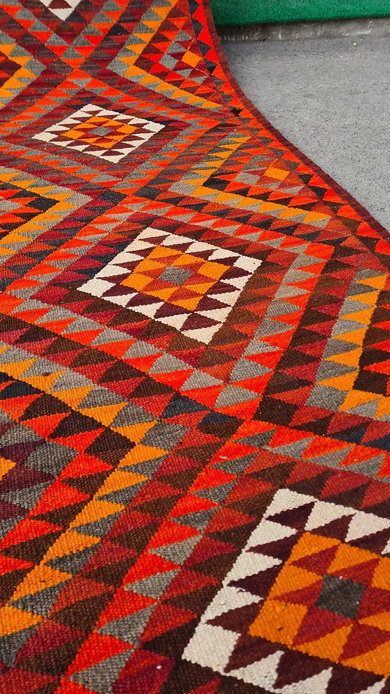 Artisan-made Afghan runner, 3x12 ft, featuring a bold diamond flat-weave design in vermilion red, persimmon orange, and ochre yellow. Durable and versatile, ideal for hallways, kitchens, or entryways, blending tradition with modern style.