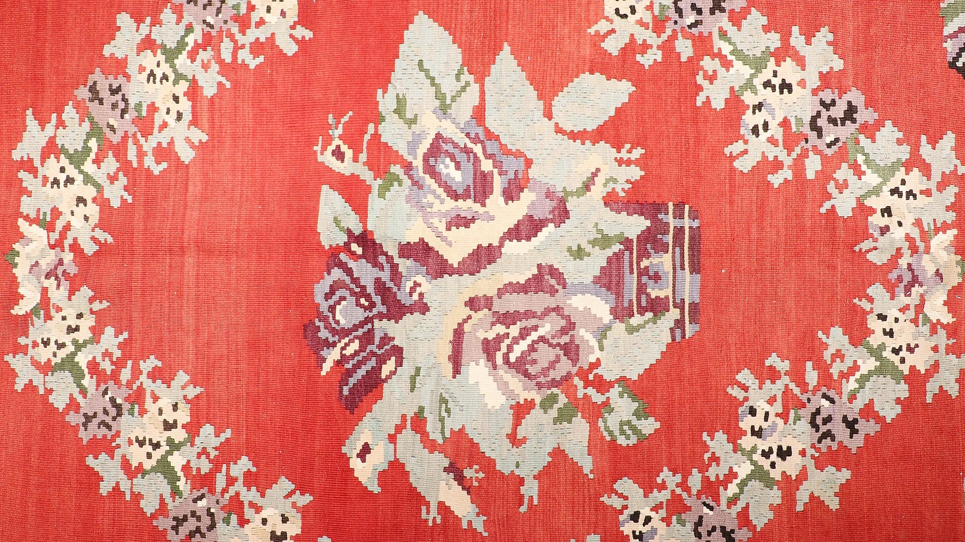 Vintage Moldavian Bessarabian Rug, 8x10 ft. This handwoven treasure showcases a deep crimson backdrop adorned with intricate floral bouquets in lavender, cream, sage, and aqua. Perfect for eclectic or bohemian interiors, its timeless European design adds character and warmth to any space.