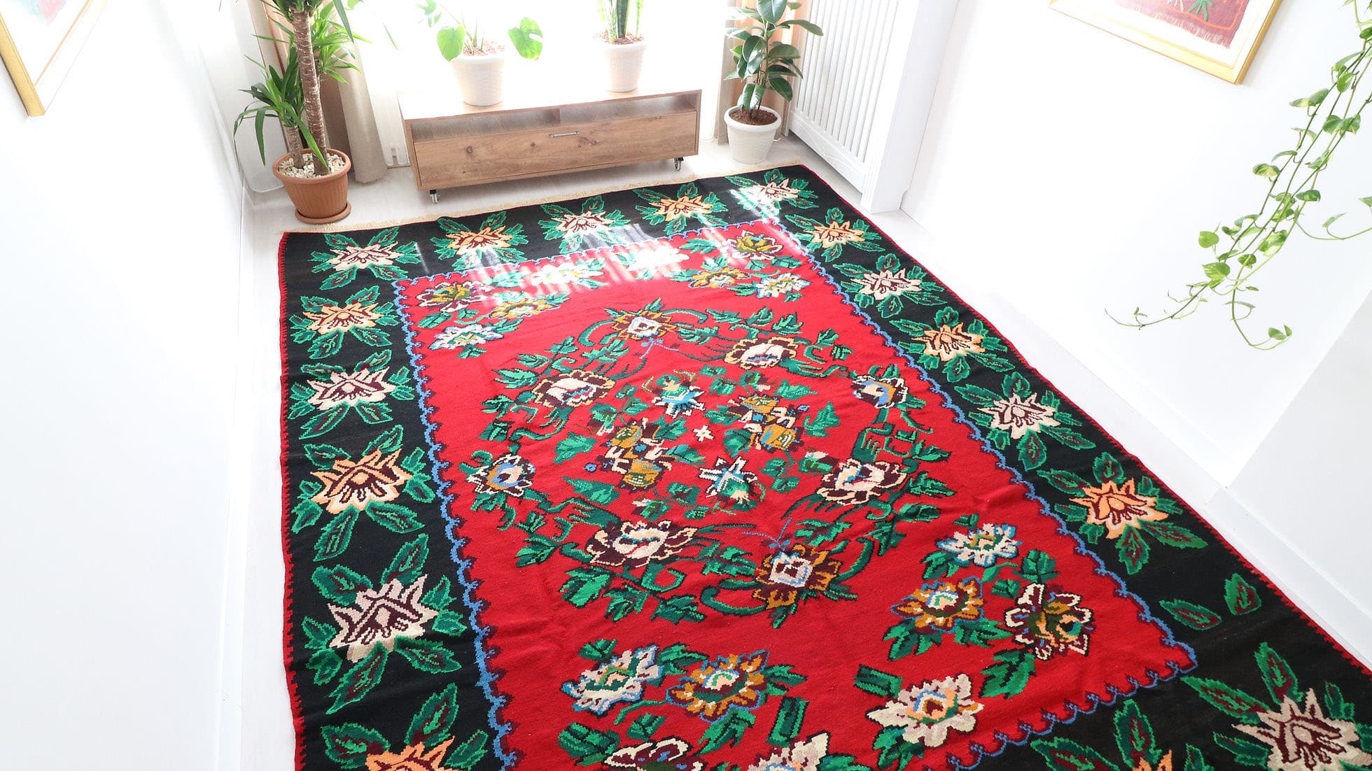 Vintage Bessarabian Rug, 9x11 ft. A handwoven mid-20th-century Romanian masterpiece, featuring a rich oriental red background with five opulent floral bouquets in cream, blue, orange, and red. This timeless European flat-weave rug blends Turkish, Persian, and Western influences, making it a striking statement piece for classic and eclectic interiors.