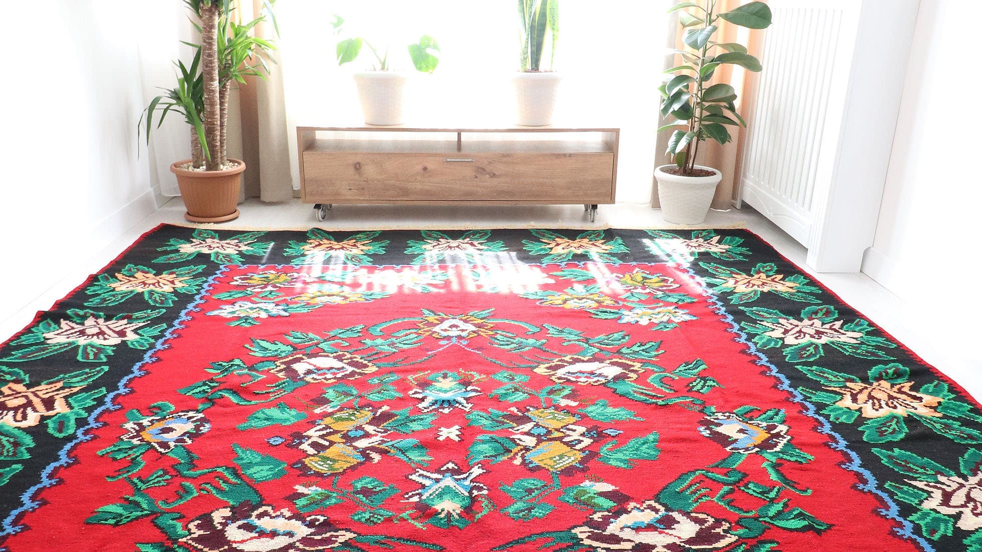 Vintage Bessarabian Rug, 9x11 ft. A handwoven mid-20th-century Romanian masterpiece, featuring a rich oriental red background with five opulent floral bouquets in cream, blue, orange, and red. This timeless European flat-weave rug blends Turkish, Persian, and Western influences, making it a striking statement piece for classic and eclectic interiors.