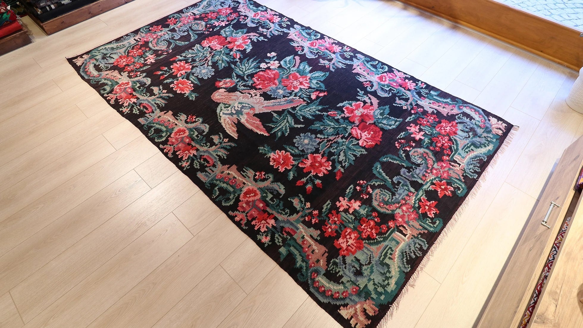 vintage karabagh tapestry in black with pink rose and parrot patterns