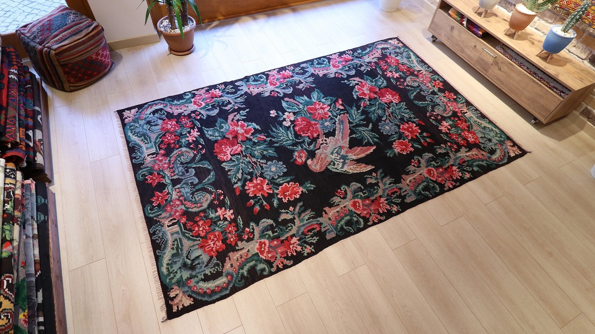 vintage karabagh tapestry in black with pink rose and parrot patterns
