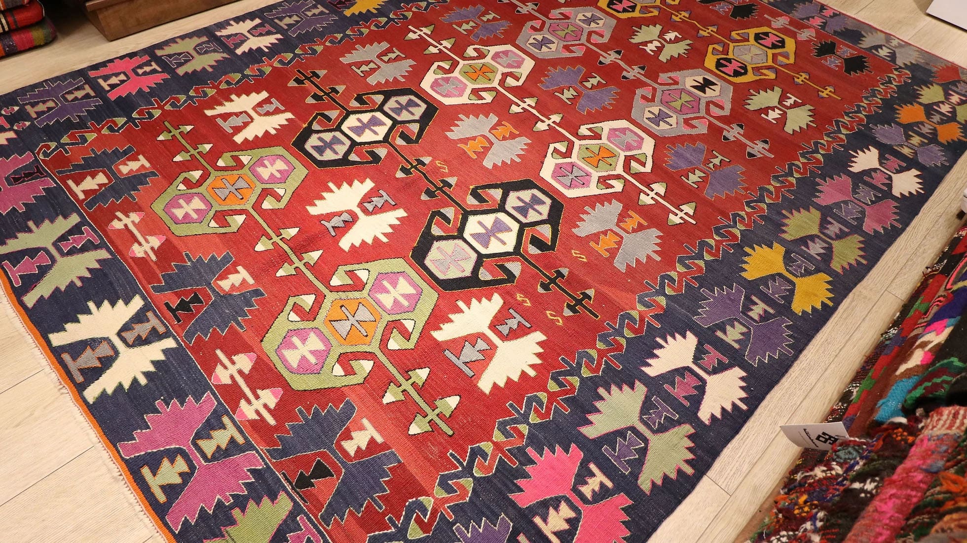 beautiful nomadic tribal flat-woven rug from Denizli, Turkey in red and blue geometric traditional motifs
