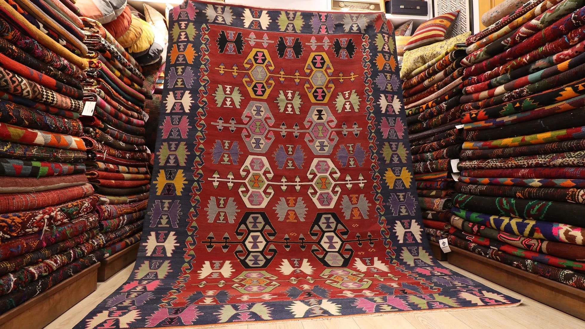 beautiful nomadic tribal flat-woven rug from Denizli, Turkey in red and blue geometric traditional motifs