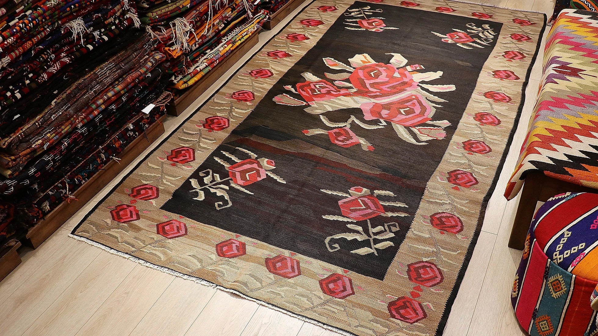 vintage hand-knotted Turkish Kars Karabakh floral tapestry in earthy brown and red tones with rose motifs and a very ancient look