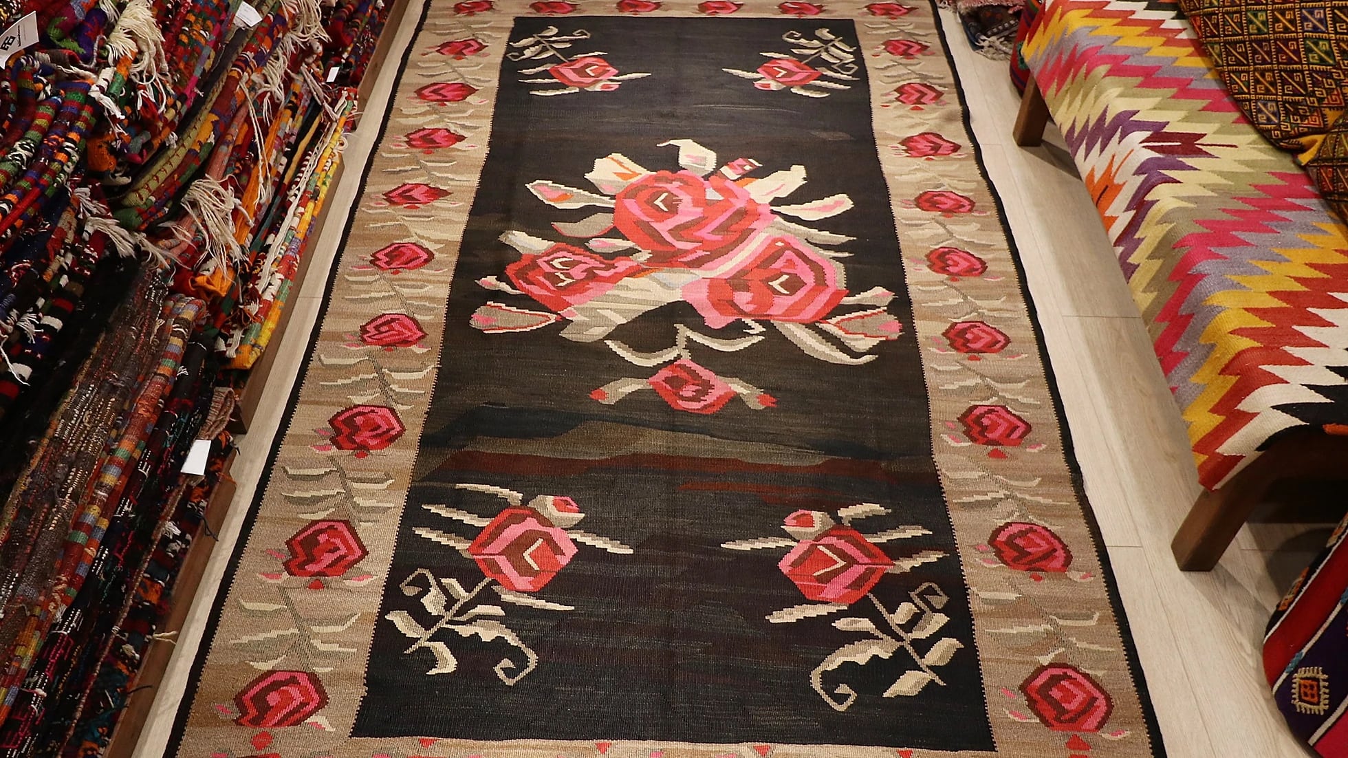 vintage hand-knotted Turkish Kars Karabakh floral tapestry in earthy brown and red tones with rose motifs and a very ancient look