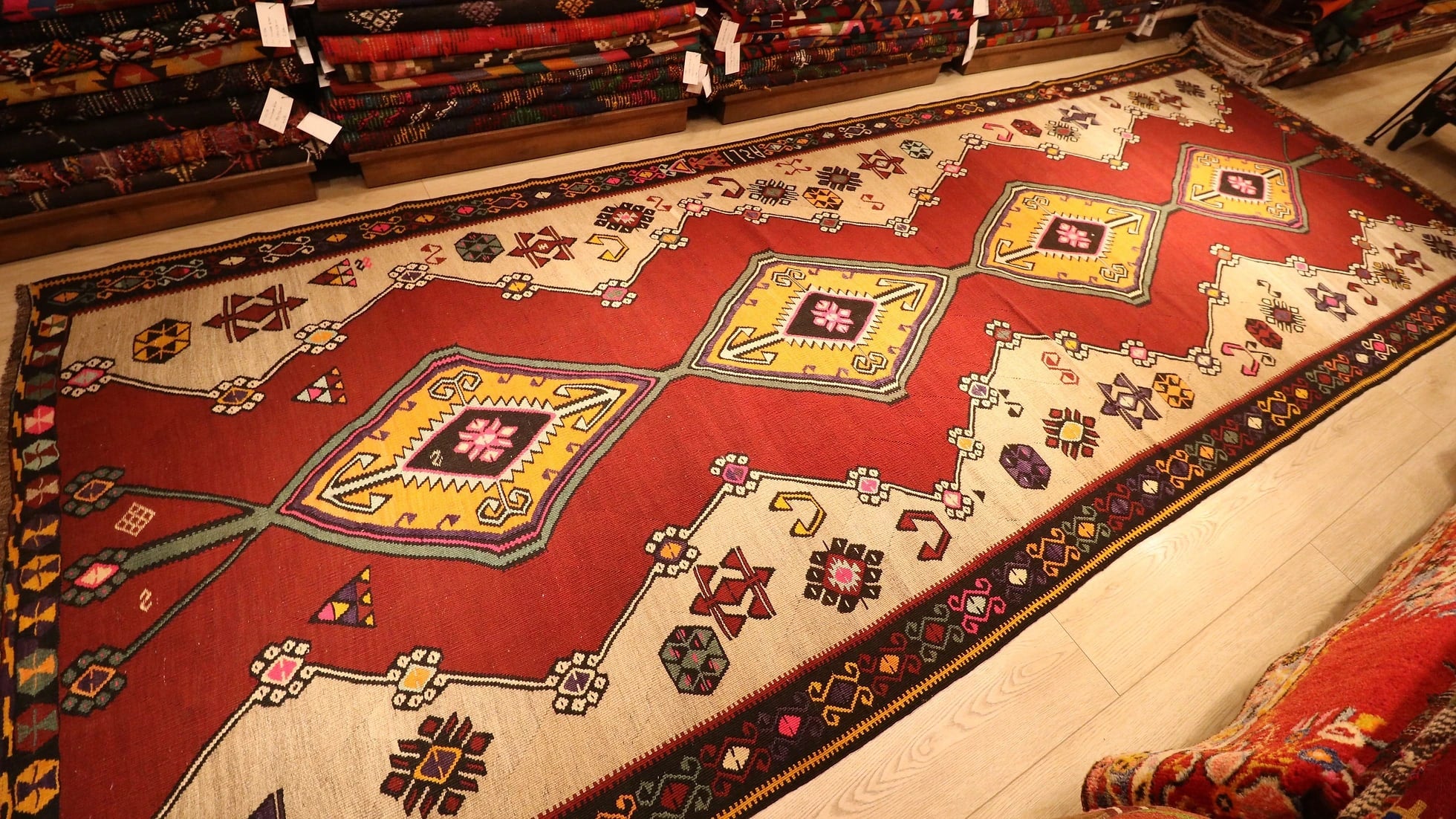 vintage gorgeous kars medallion runner rug showcasing many traditional Anatolian patterns and motifs in earthy and vibrant colors
