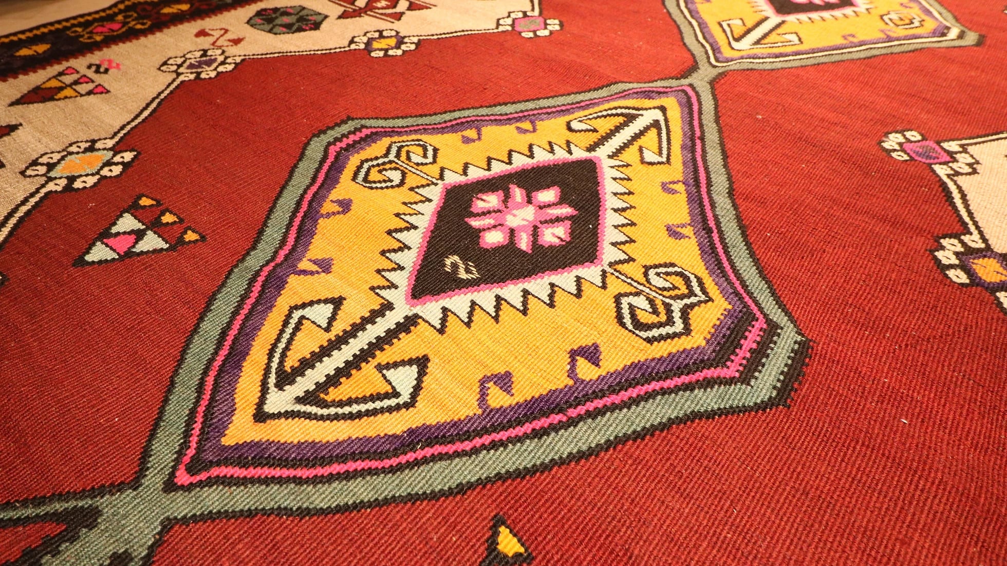 vintage gorgeous kars medallion runner rug showcasing many traditional Anatolian patterns and motifs in earthy and vibrant colors in detail
