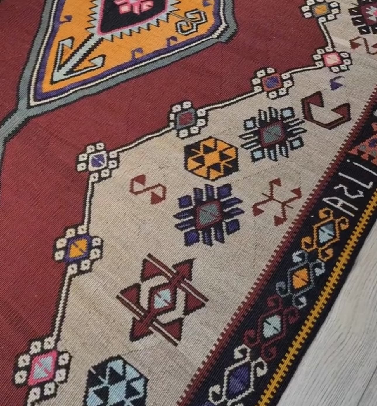 name signature of vintage gorgeous kars medallion runner rug showcasing many traditional Anatolian patterns and motifs in earthy and vibrant colors