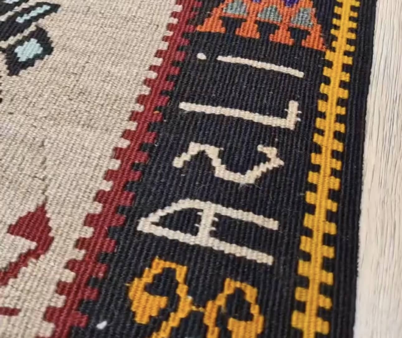 name signature of vintage gorgeous kars medallion runner rug showcasing many traditional Anatolian patterns and motifs in earthy and vibrant colors