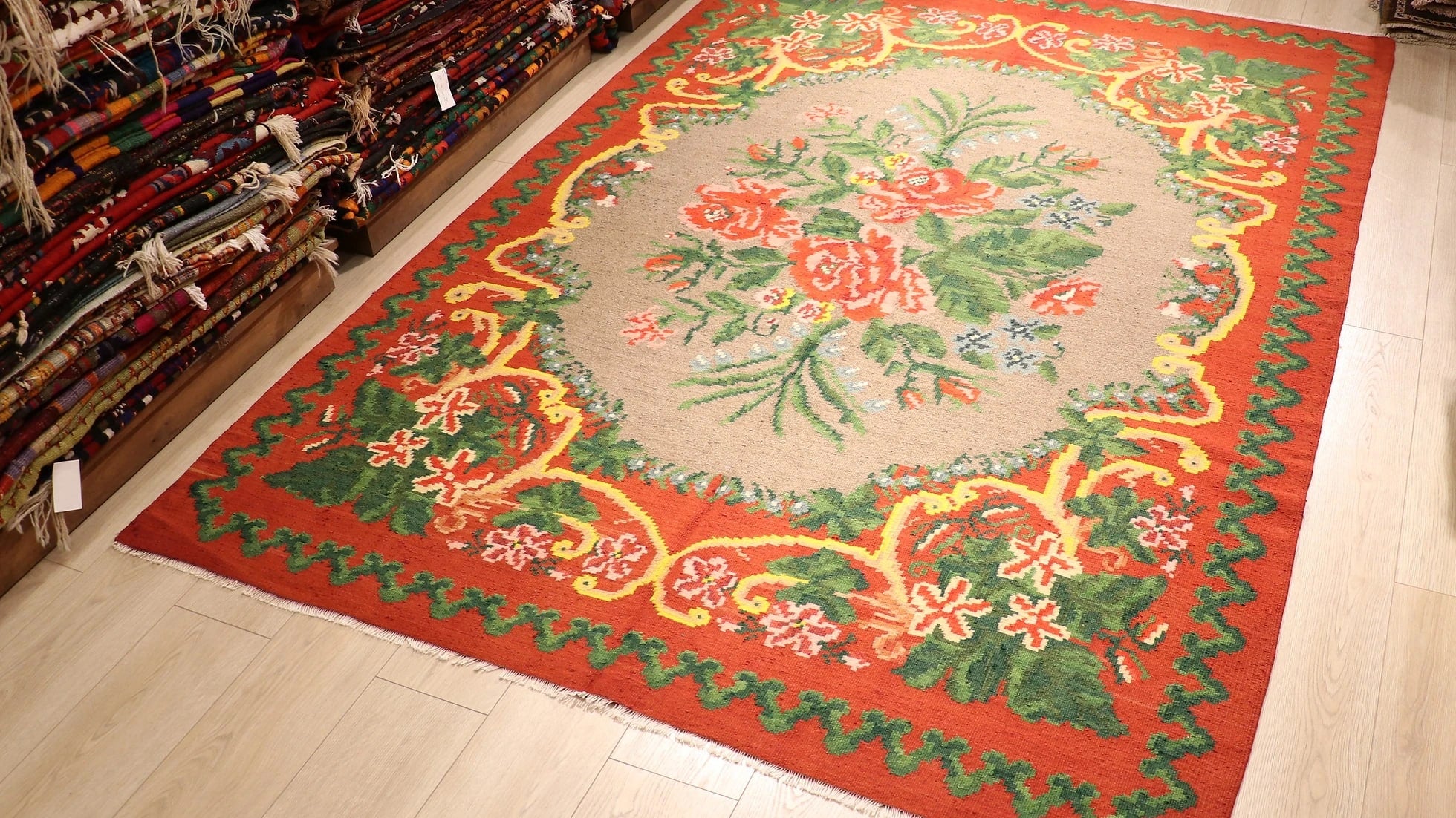 gorgeous Moldovan European tapestry rug from Turkey in flower motifs, floral patterns, and geometric medallion in red, green, yellow, and gray
