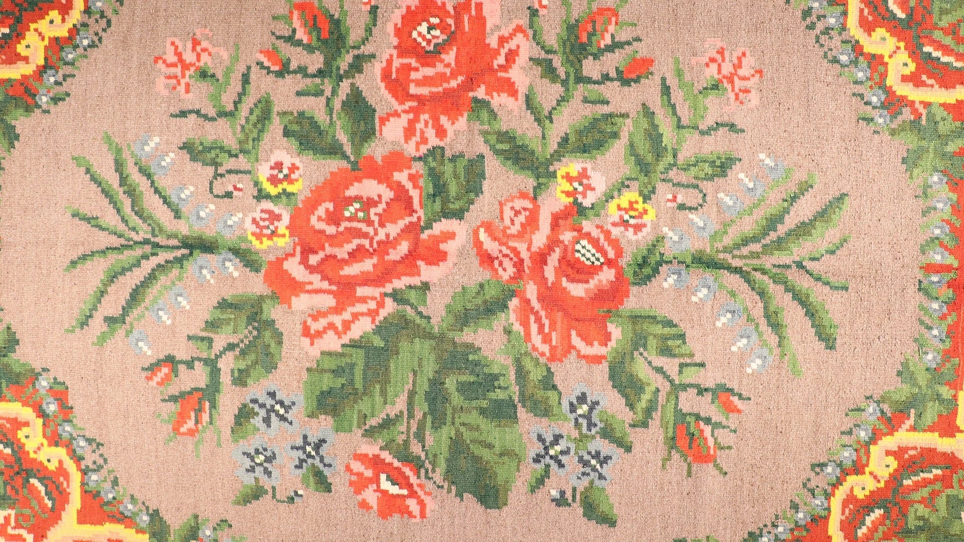 gorgeous Moldovan European tapestry rug from Turkey in flower motifs, floral patterns, and geometric medallion in red, green, yellow, and gray in detail