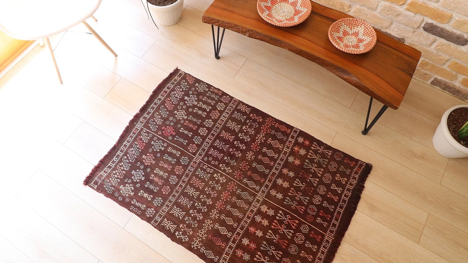 mid-century handmade Moroccan flat-woven kilim rug with tribal motifs in muted earthy taupe and terracotta shades measuring 3x5 ft